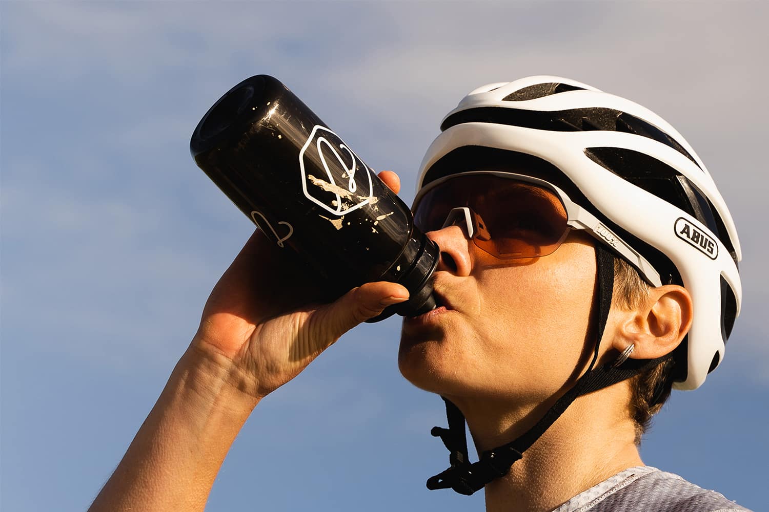 cycling and drinking Veloforte bottle