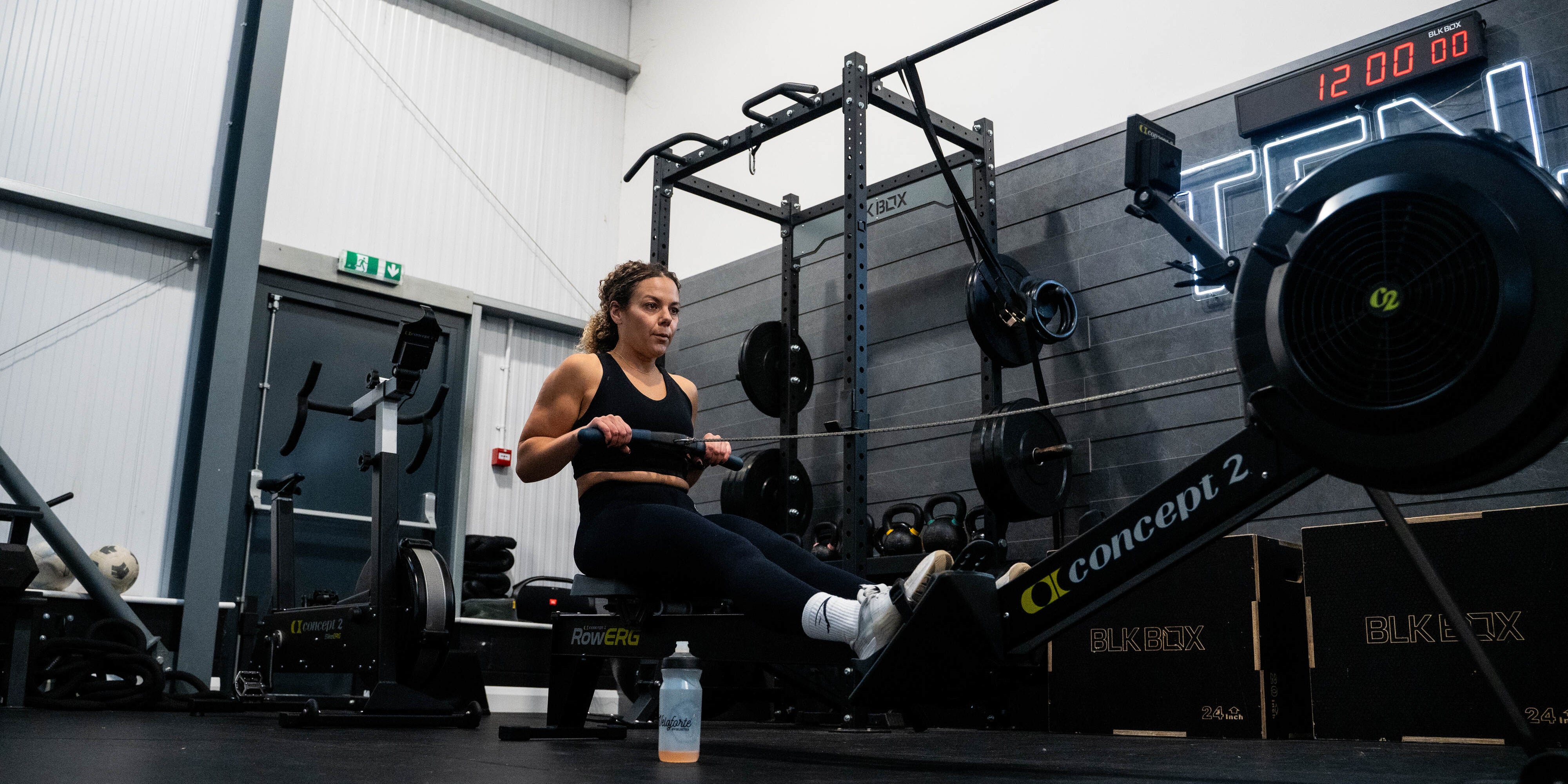 An image of a woman rowing in a gym