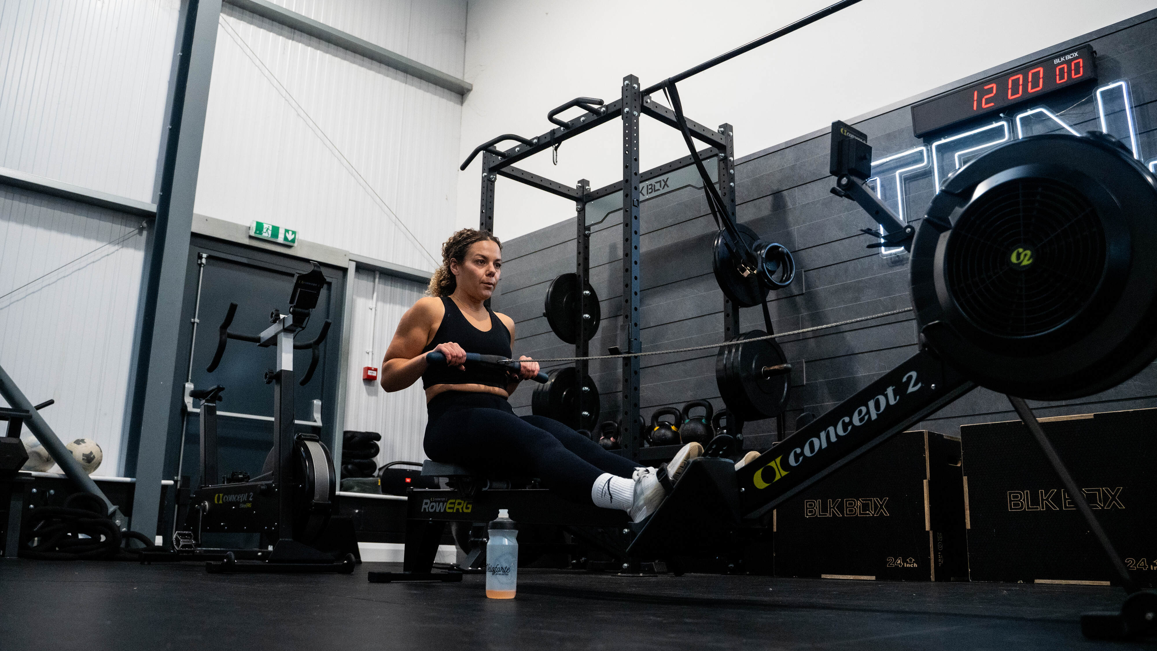 An image of a woman rowing in a gym