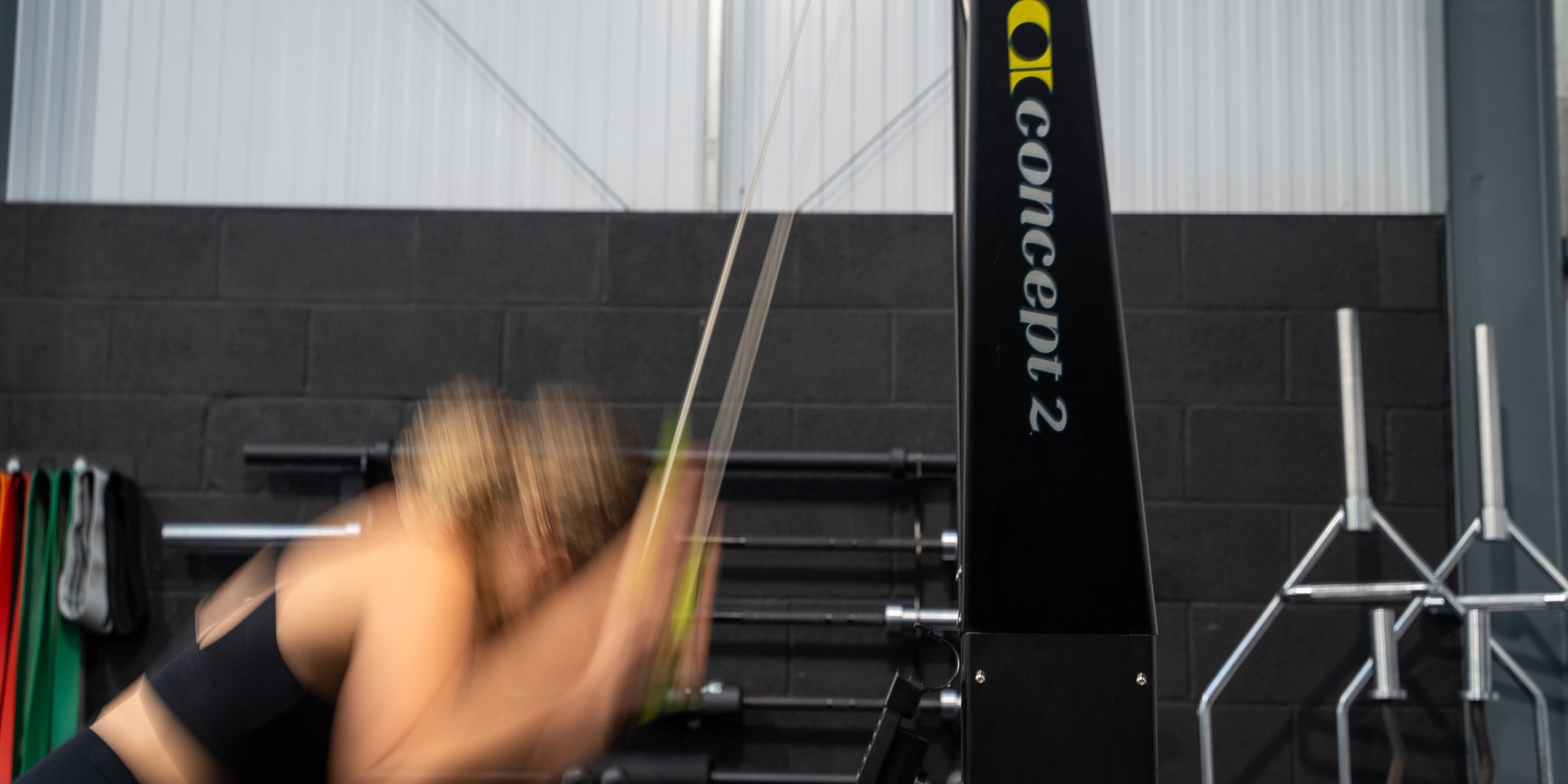 A woman training for Hyrox in the gym