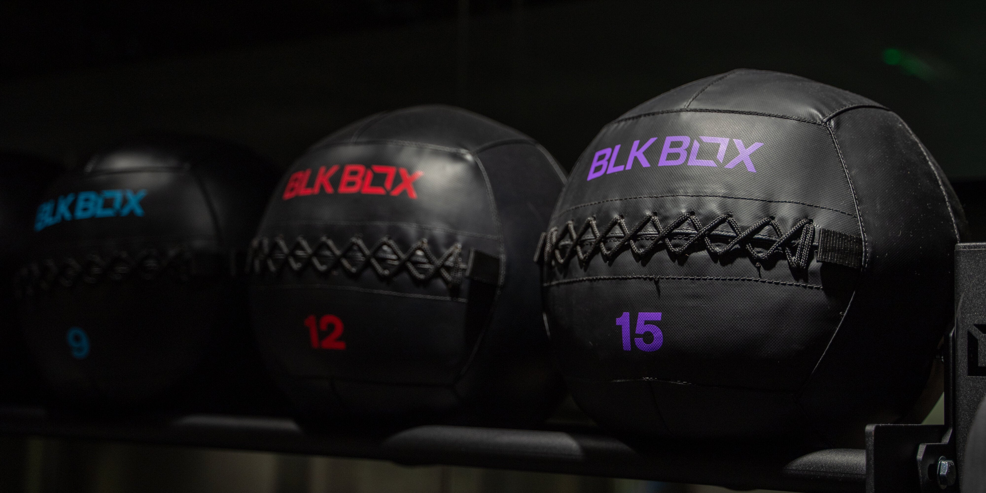 An image of medicine balls in a gym