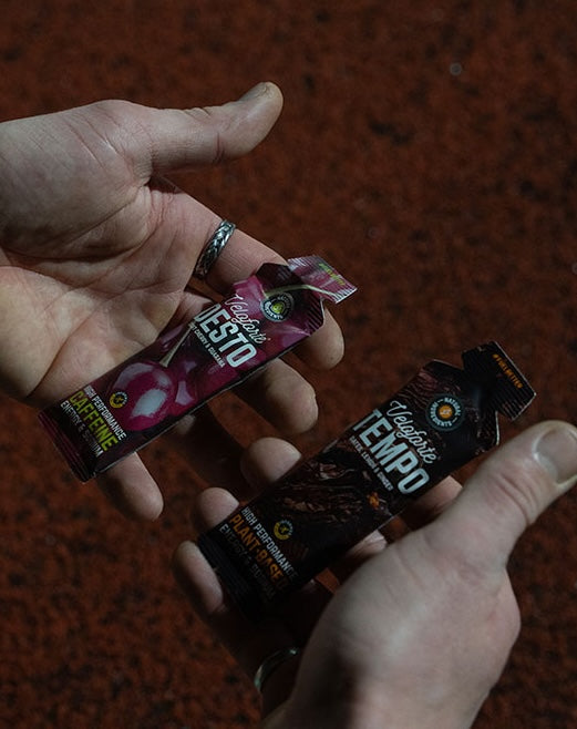cyclist on a bike eating an energy gel