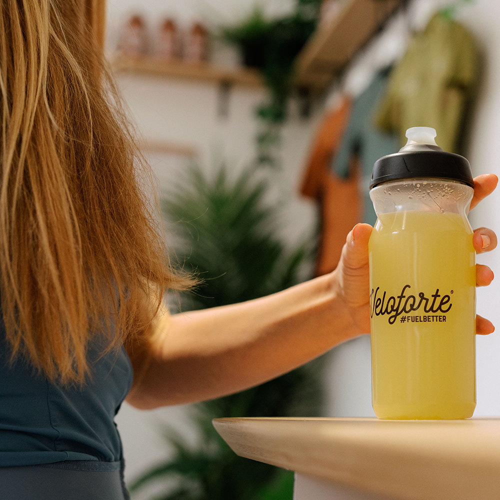 woman holding bottle with electrolytes