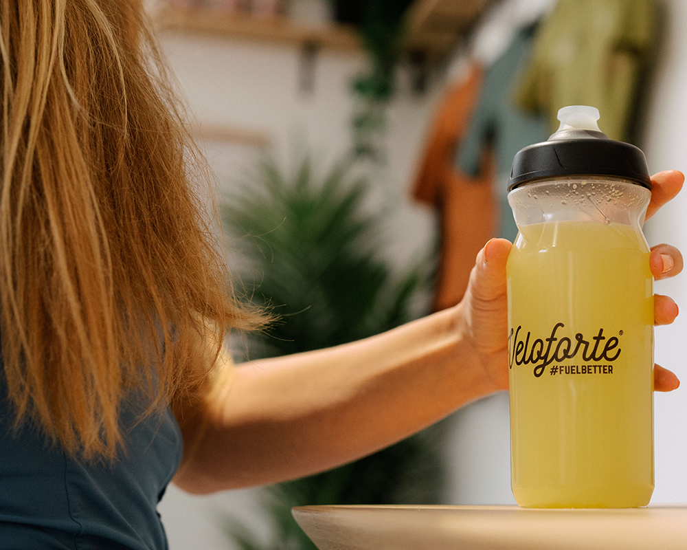 woman holding bottle with electrolytes