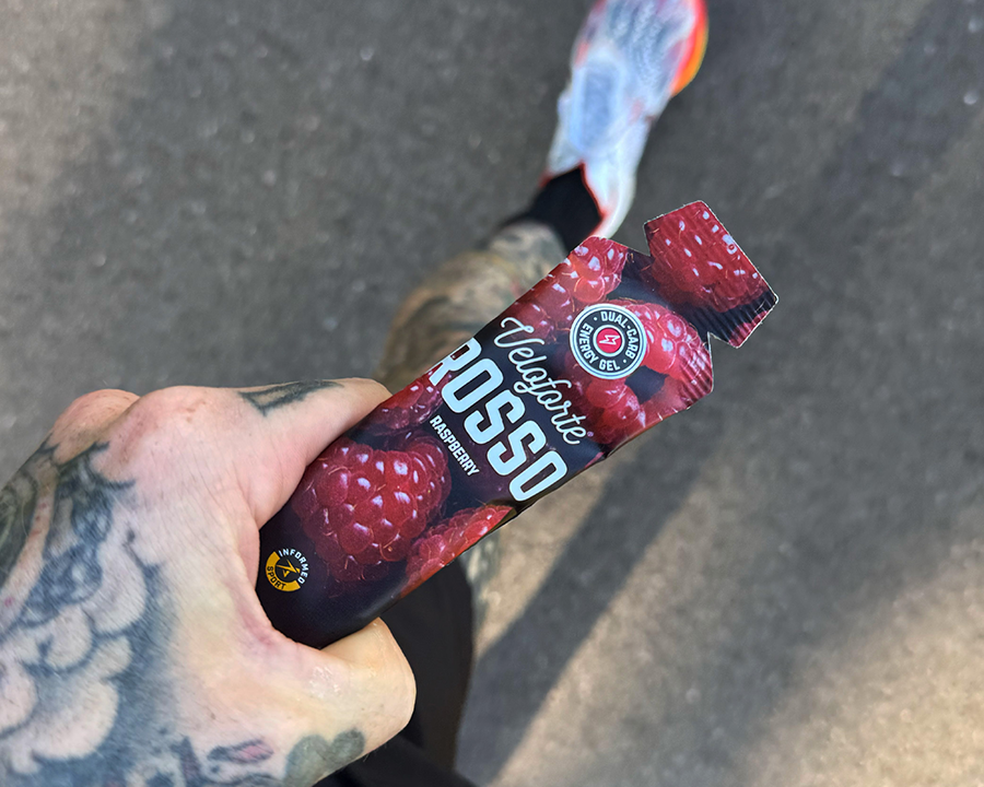 cyclist on a bike eating an energy gel
