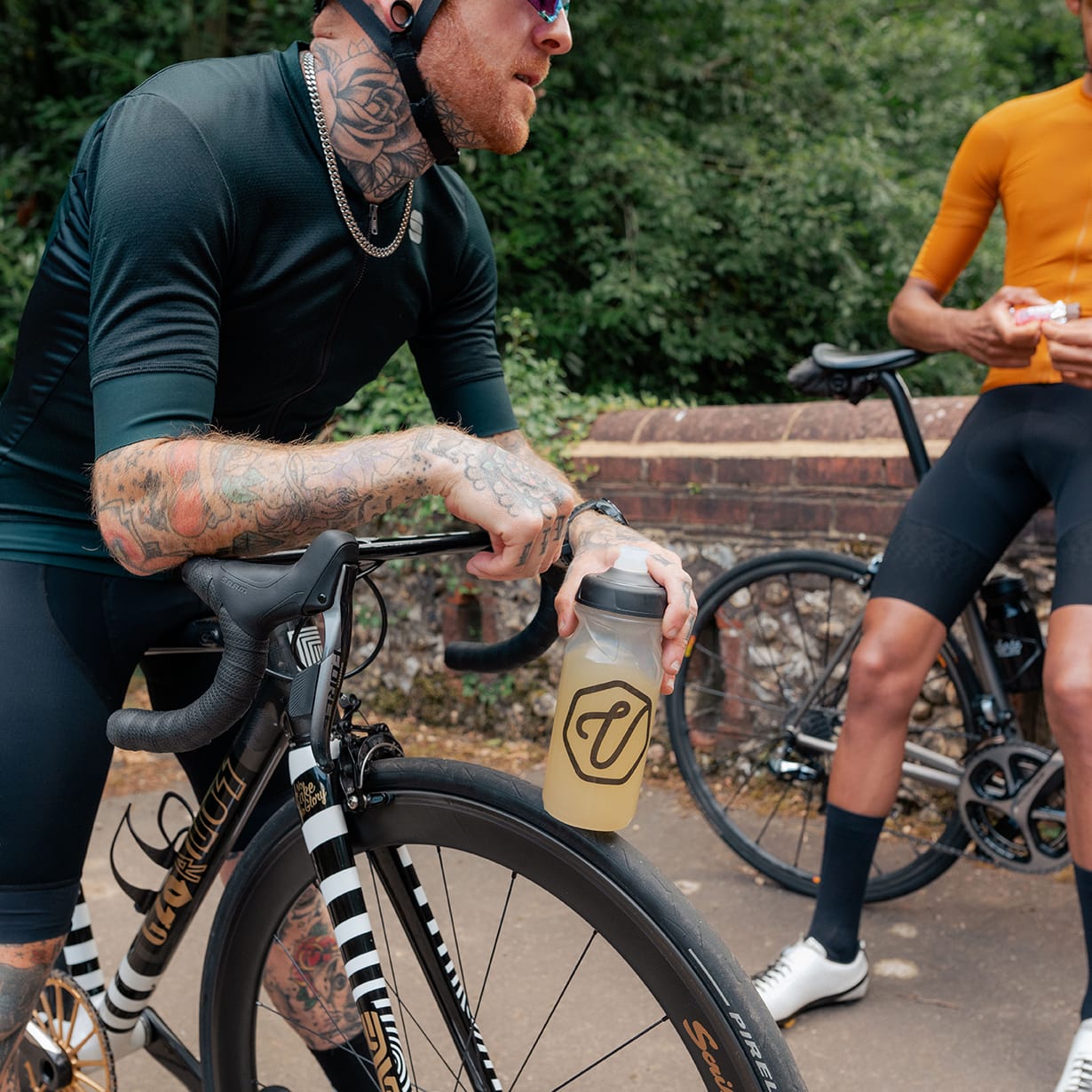 Cyclist on a bike drinking electrolytes