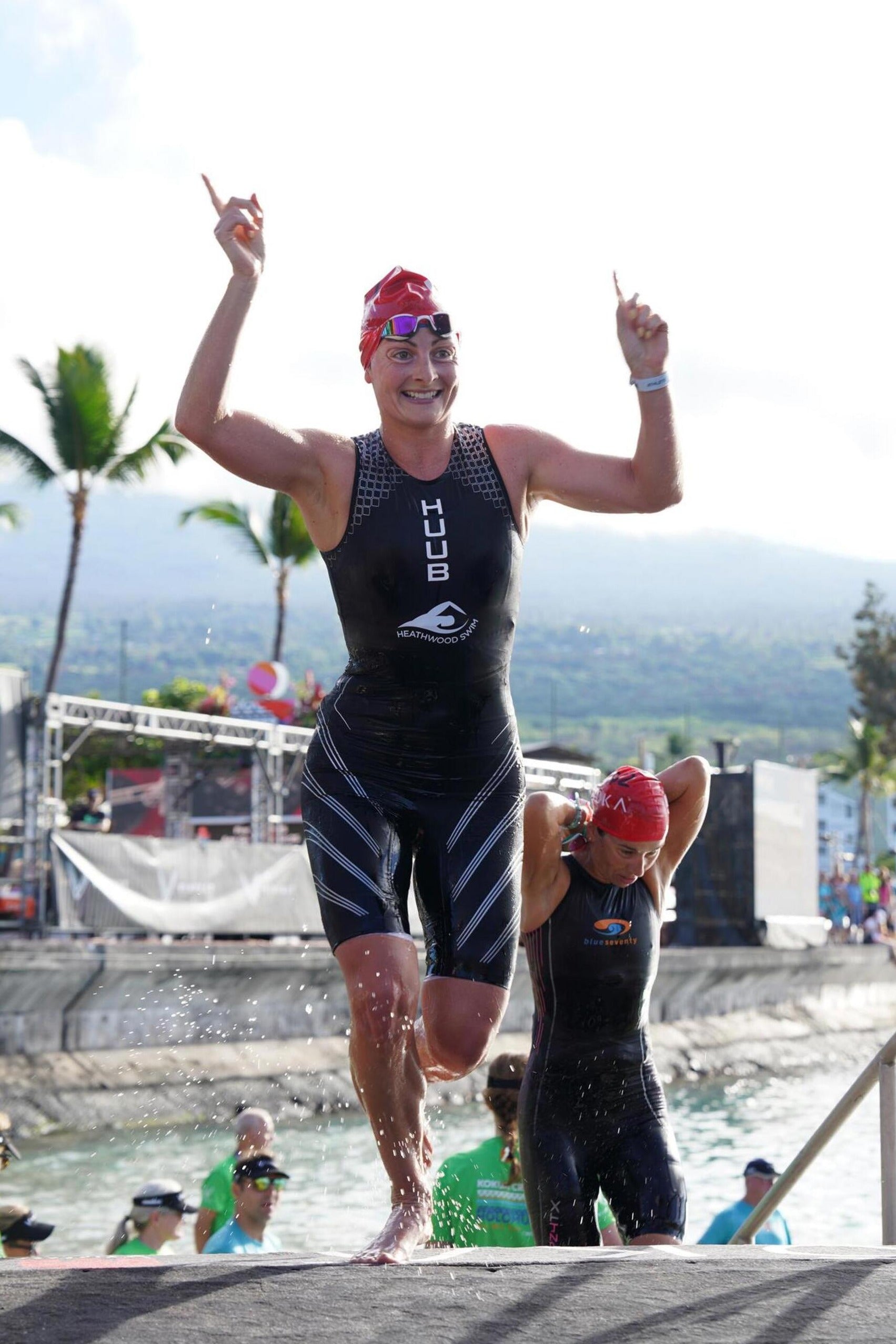 Pro athlete emerging from the water participating in an Ironman event 