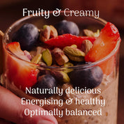 Glass of overnight oats with fruits and nuts, labeled 'Fruity & Creamy' on a dark background.