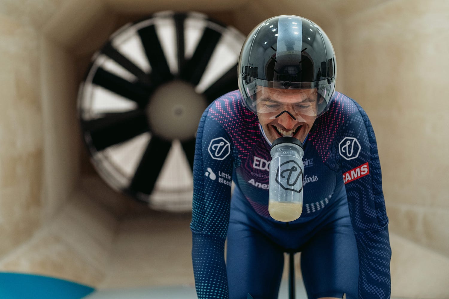 World Champion Cyclist Alex Dowsett on a bike with a Veloforte Water Bottle