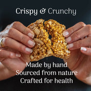 Hands holding a lime and coconut protein bar with text about its origin and health benefits.