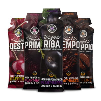Five Veloforte energy gel packages with different flavours on a white background