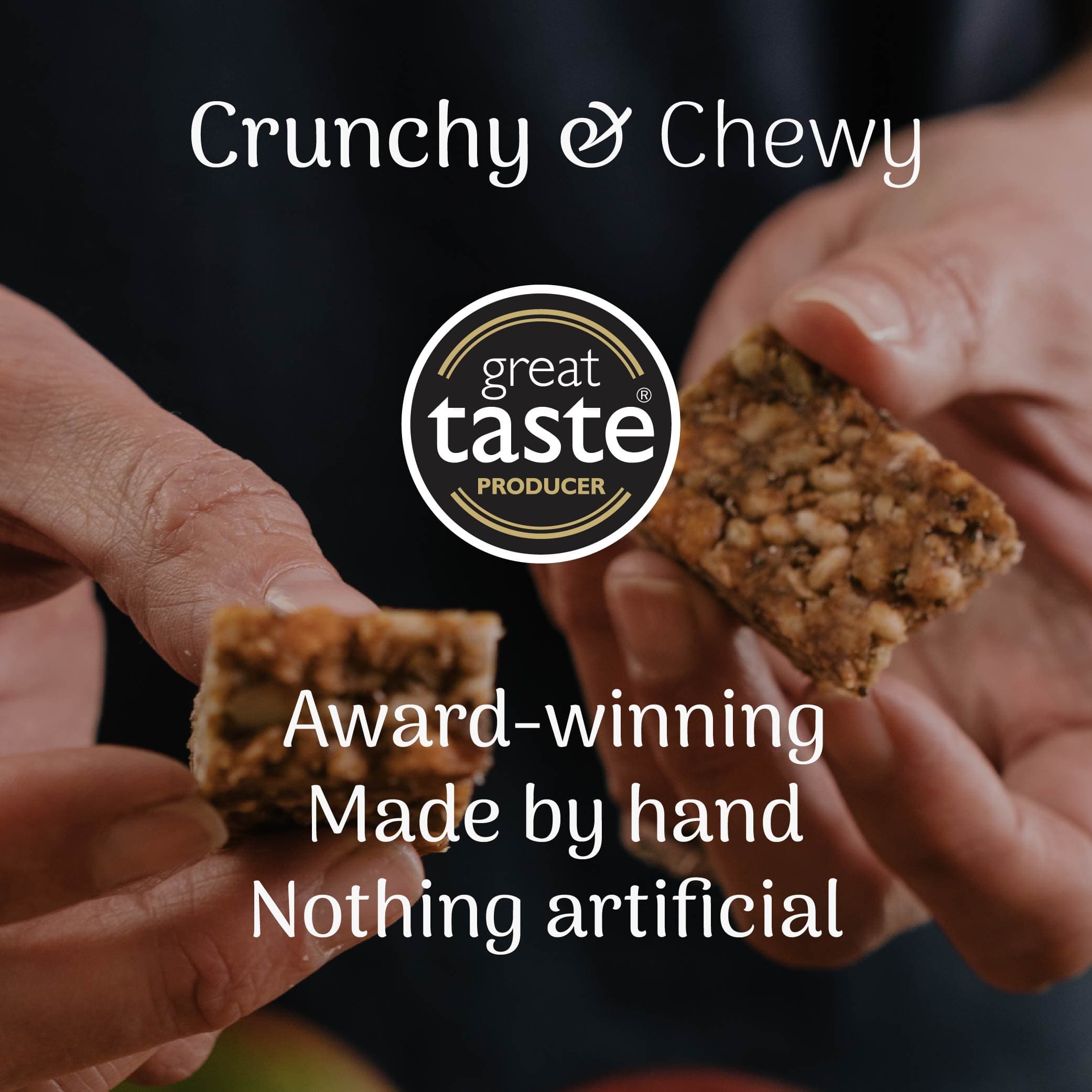 hands holding a oat snack bar with a great taste award producer badge