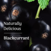 Close-up of blackcurrants with a leaf and text 'Naturally Delicious Blackcurrant' on a dark background.